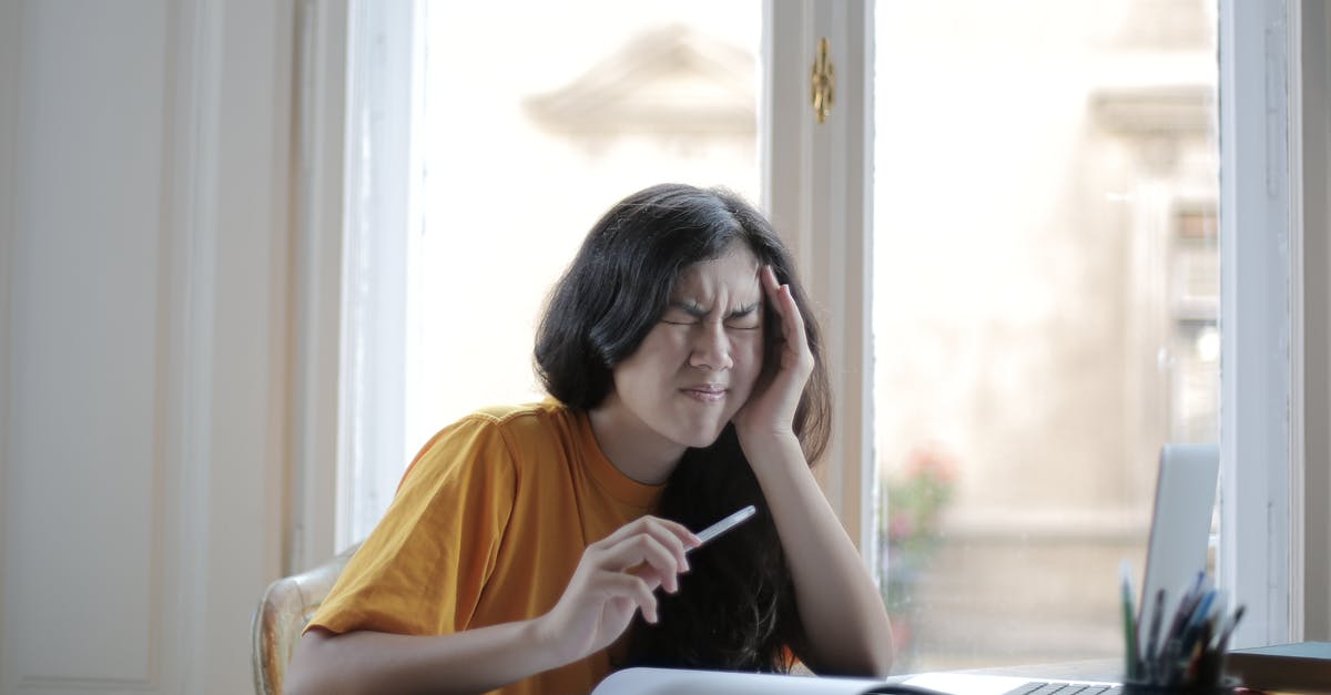 Can Jager's ADS hurt people? - Ethnic female student in casual wear sitting at table with laptop and notebook and grimacing from migraine while doing homework during distance learning Can Jager's ADS hurt people? - Ethnic female student in casual wear sitting at table with laptop and notebook and grimacing from migraine while doing homework during distance learning