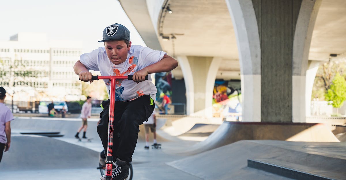 Can lee sin be grabbed during his Q jump kick? - Boy in Gray Cap Riding Kick Scooter