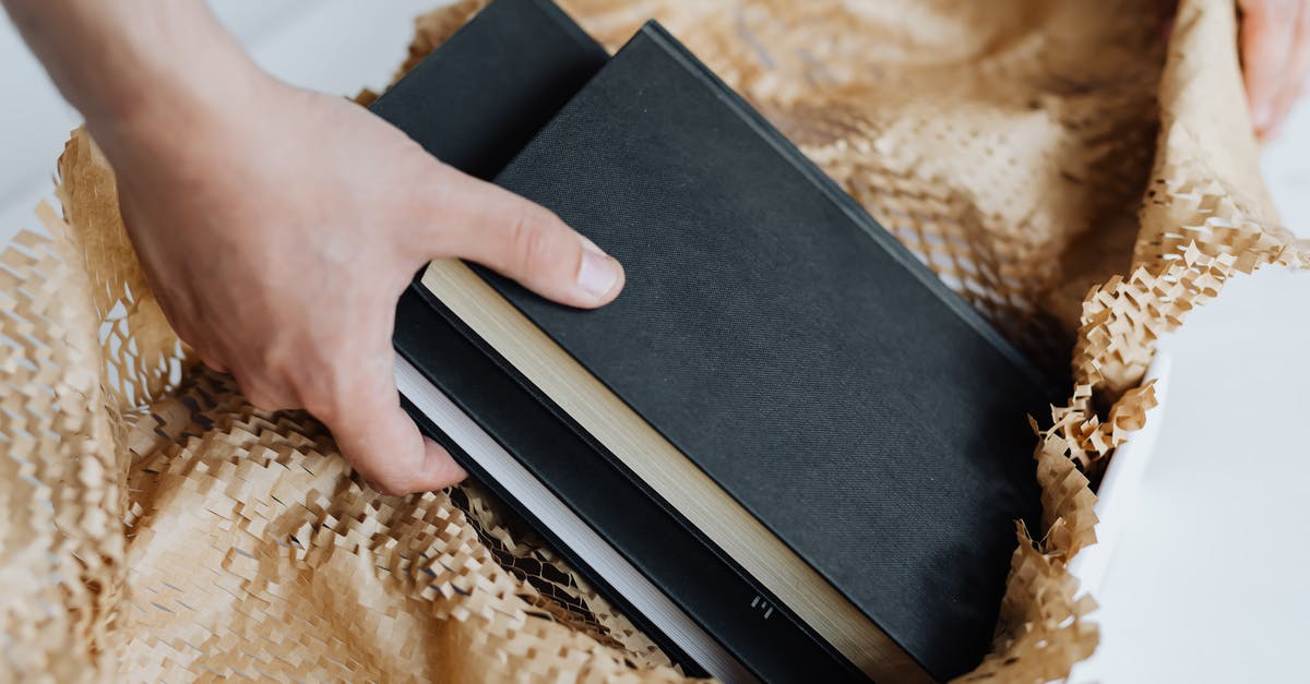 Can Mystery Gift send more than one item at a time? - Anonymous man preparing notebooks for sending by post Can Mystery Gift send more than one item at a time? - Anonymous man preparing notebooks for sending by post
