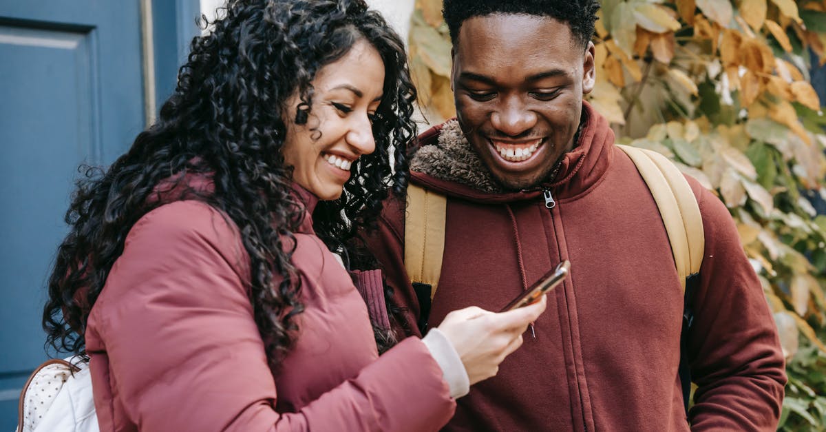 Can Necromactic Scroll and Papyrus Scarab be used at the same time? - Cheerful diverse couple smiling and sharing smartphone Can Necromactic Scroll and Papyrus Scarab be used at the same time? - Cheerful diverse couple smiling and sharing smartphone