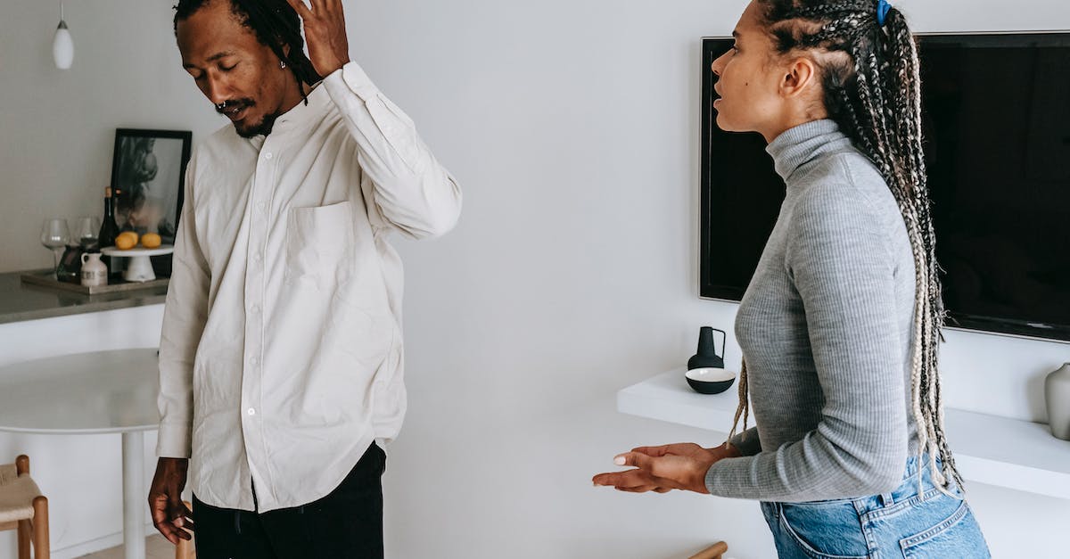 Can negative companion conversation choices be repaired? - Tired young ethnic man with dreadlocks in casual outfit gesticulating while having argument with wife at home Can negative companion conversation choices be repaired? - Tired young ethnic man with dreadlocks in casual outfit gesticulating while having argument with wife at home