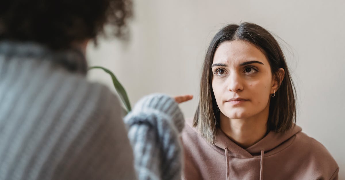 Can negative companion conversation choices be repaired? - Sad young ladies in casual clothes standing in light apartment near wall while having disagreement and pointing finger in face while looking at each other Can negative companion conversation choices be repaired? - Sad young ladies in casual clothes standing in light apartment near wall while having disagreement and pointing finger in face while looking at each other