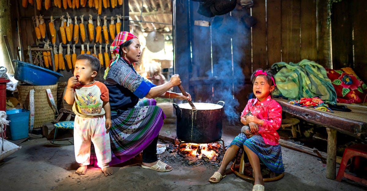 can no longer Buy fire or explosive arrows in Far Cry 4 - Ethnic mother preparing food against crying girl and baby indoors can no longer Buy fire or explosive arrows in Far Cry 4 - Ethnic mother preparing food against crying girl and baby indoors