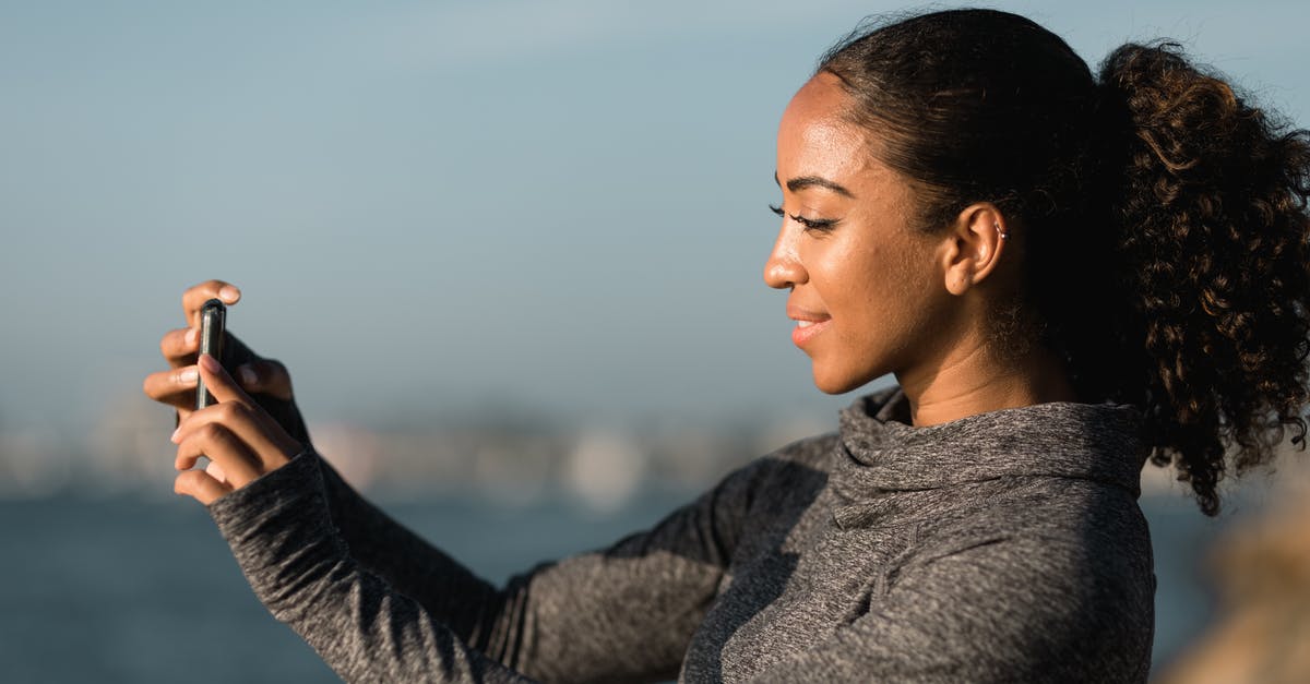 Can pokemon run while taking a picture? - Side View of a Woman Taking Pictures with her Smartphone Can pokemon run while taking a picture? - Side View of a Woman Taking Pictures with her Smartphone