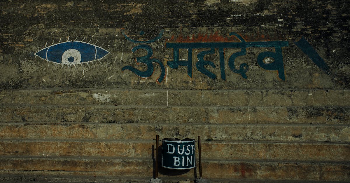 Can random events destroy your ship? - Shabby stone wall with eye ornament and Hindi inscription