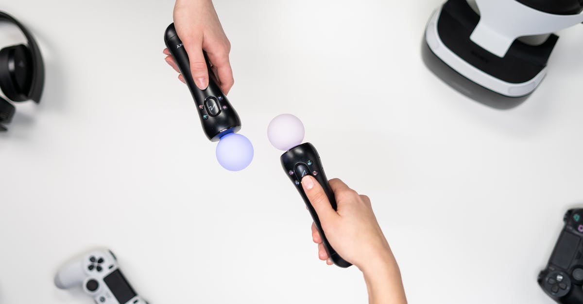 Can retail Xbox One and PlayStation 4 game disks be &ldquo;upgraded&rdquo; to digital? - Person Holding Purple and White Plastic Toy