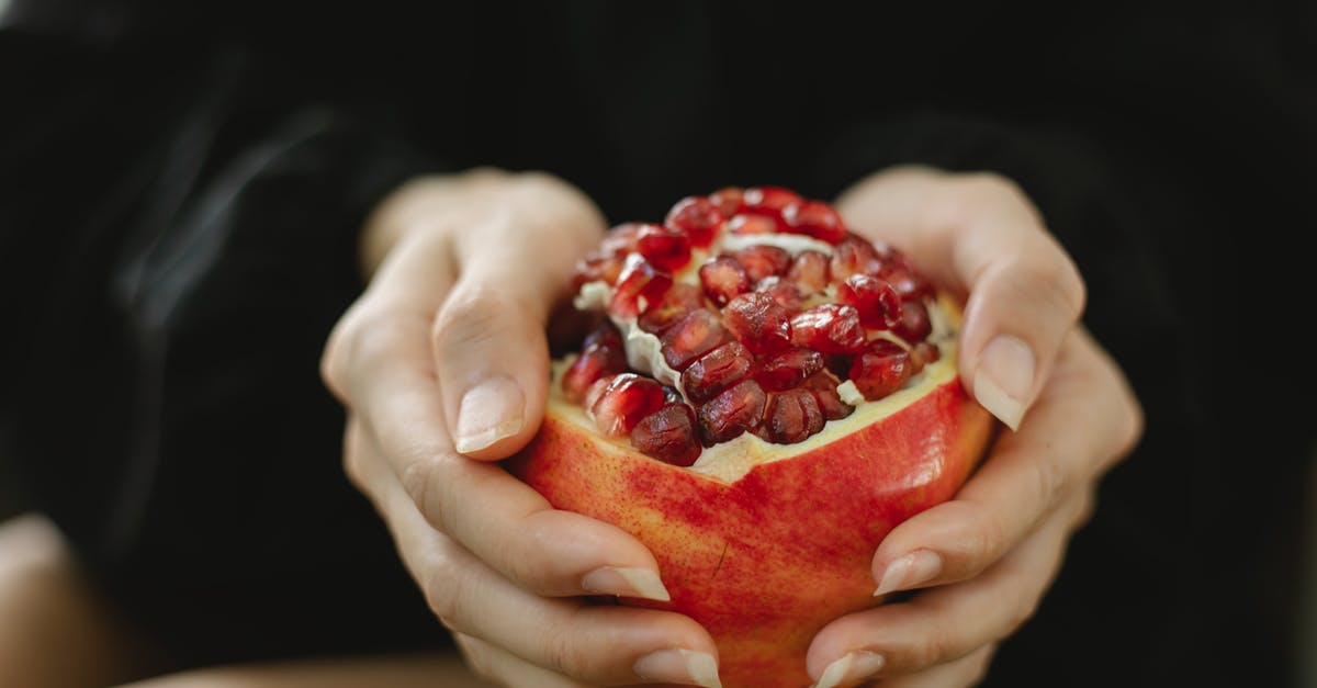 Can seed show up in a place where similar seed already show up? - Crop anonymous female sitting with red pomegranate with juicy seeds for healthy organic diet Can seed show up in a place where similar seed already show up? - Crop anonymous female sitting with red pomegranate with juicy seeds for healthy organic diet