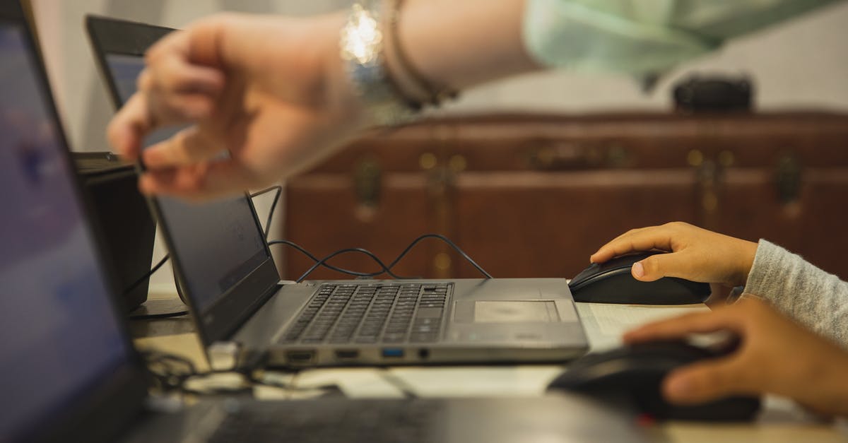Can someone explain the process using Playstation Now directly on a TV? - Crop anonymous female teacher pointing at netbook screen near schoolchildren touching mouses at desk in classroom Can someone explain the process using Playstation Now directly on a TV? - Crop anonymous female teacher pointing at netbook screen near schoolchildren touching mouses at desk in classroom