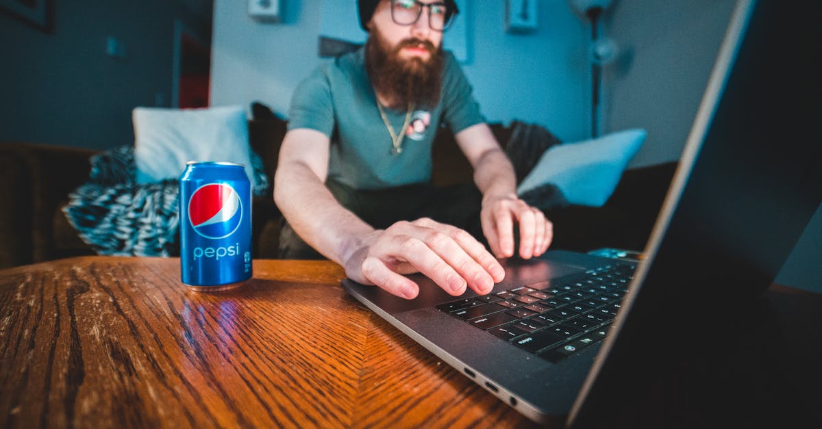 Can someone recognize this FPS from a sceenshot? - Man in Blue Polo Shirt Using Black Laptop Computer