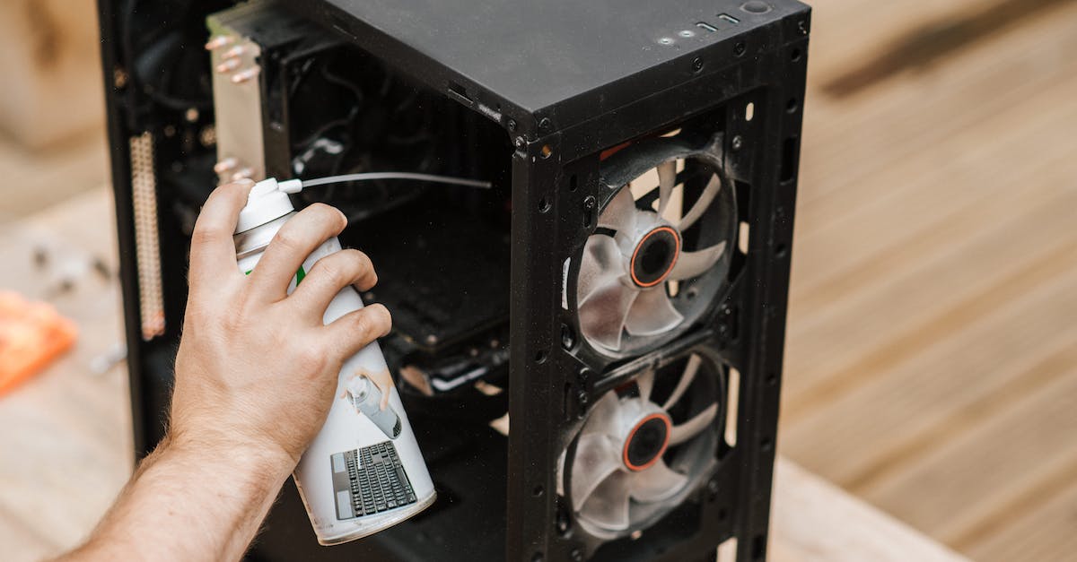 Can systems be replaced once all rooms are occupied? - Crop unrecognizable man cleaning computer system unit
