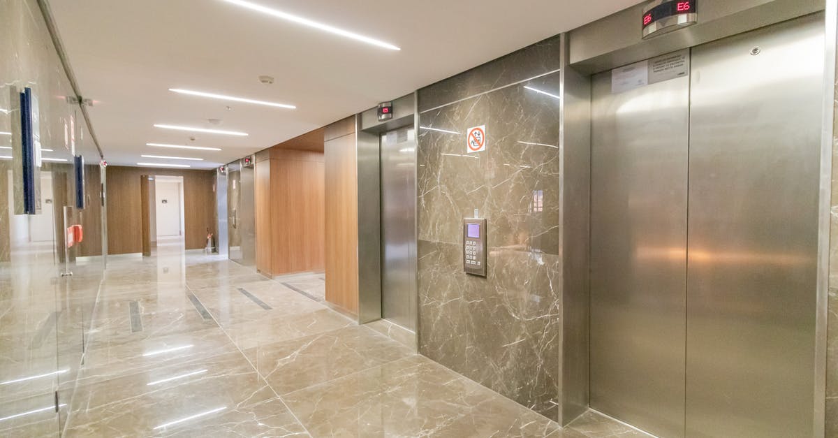 Can the entrance elevator be removed? - Corridor of modern building with elevators Can the entrance elevator be removed? - Corridor of modern building with elevators