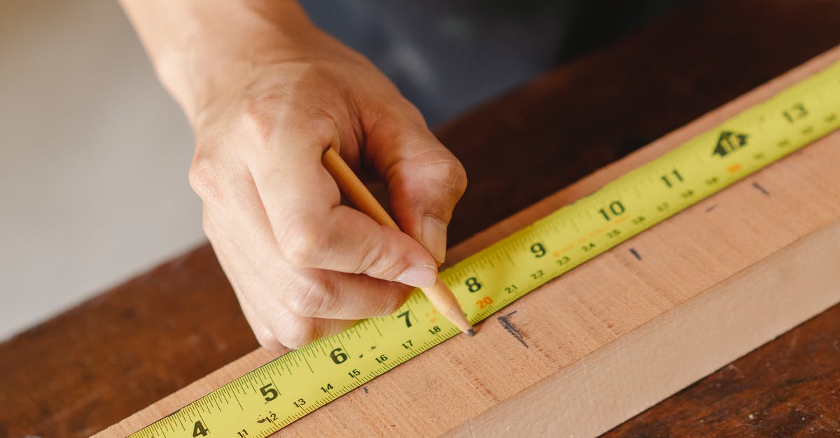 Can the mark tool be used to mark all scrap for ease of looting? - Man making marks on wooden plank with measurement tape