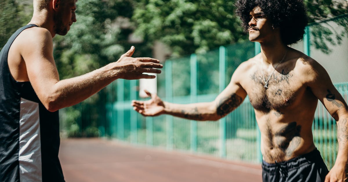Can the players see the enemy in CounterStrike? - Topless Man in Black Shorts Standing on Brown Field