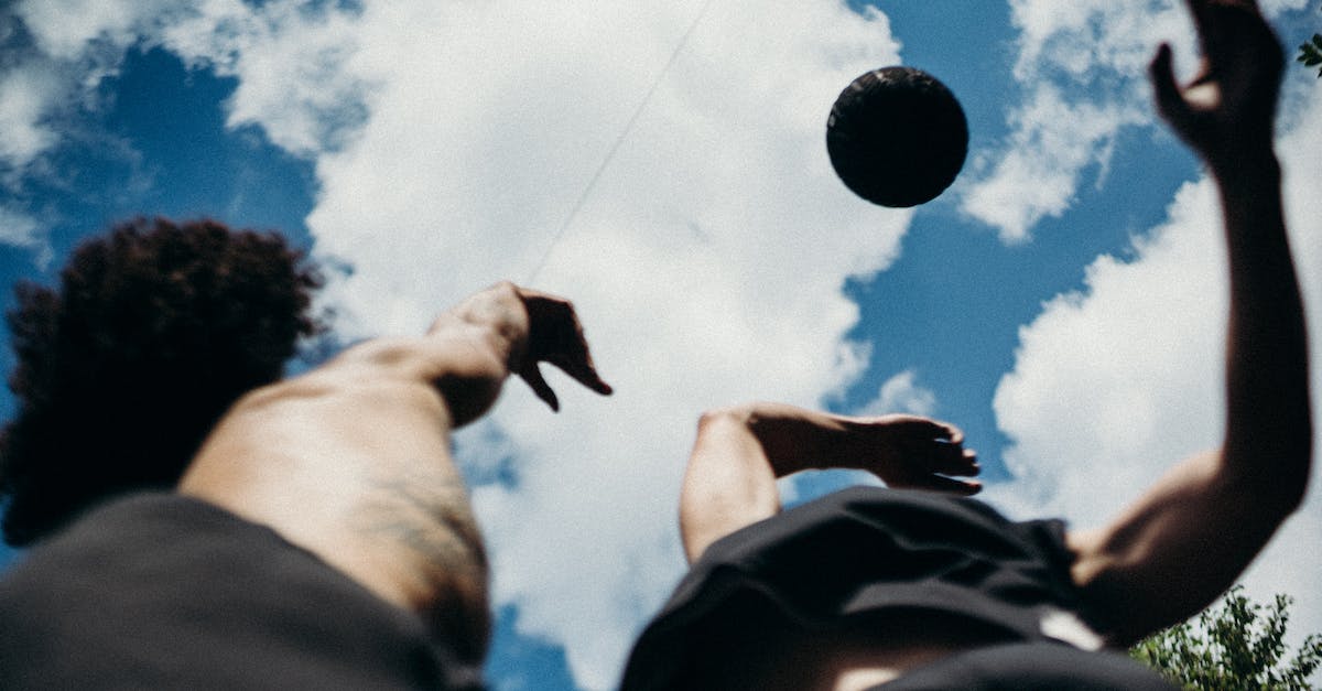 Can the players see the enemy in CounterStrike? - Person Holding Ball Under Blue Sky