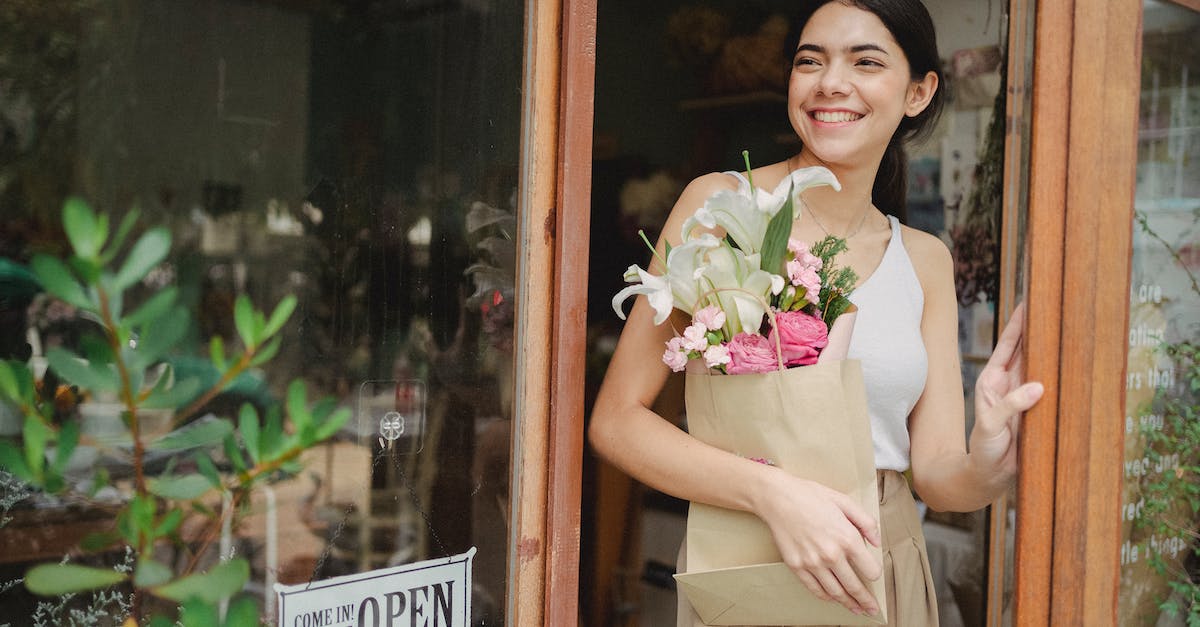 Can the Rings of Mara be given away if you buy the Imperial Edition of ESO? - Toothy smiling female standing near flower shop and holding paper package with bouquet