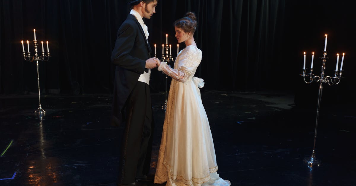 Can the Starlet Sniper outfit be worn by male and female characters? - Man Standing Face To Face To A Woman in White Dress
