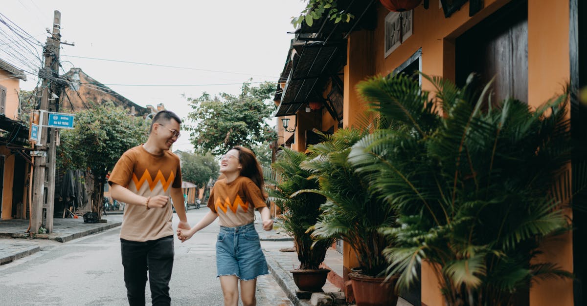 Can two servers run on the same machine? - Cheerful Asian couple running on street