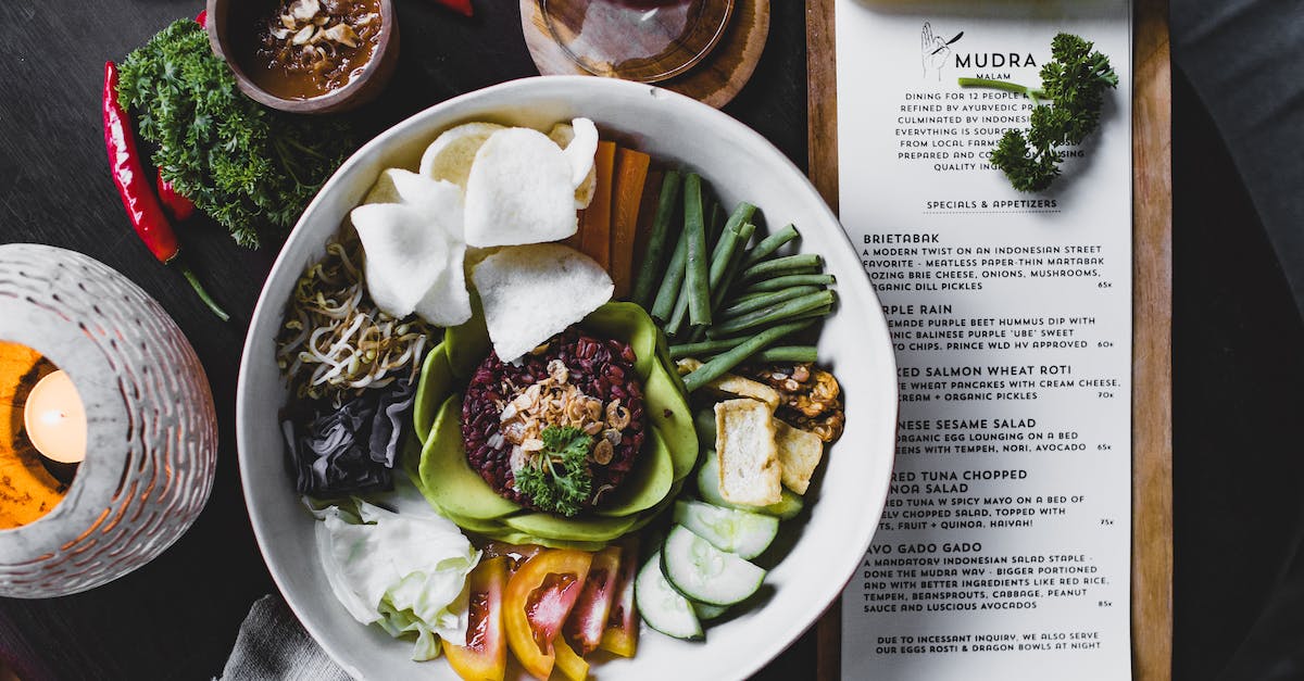 Can Vegans eat Jewelry? - Mixed exotic salad served with sauce in summer cafe Can Vegans eat Jewelry? - Mixed exotic salad served with sauce in summer cafe