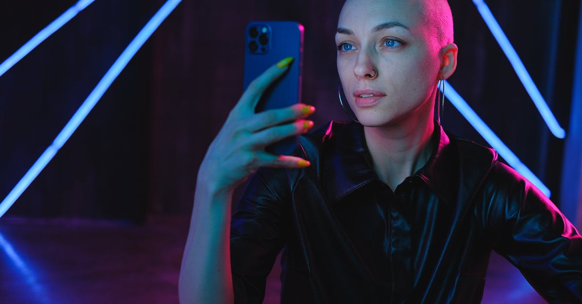 Can you 100% complete Dark Souls 3 using only melee weapon? - Young Bald woman using photos on smartphone in neon studio Can you 100% complete Dark Souls 3 using only melee weapon? - Young Bald woman using photos on smartphone in neon studio