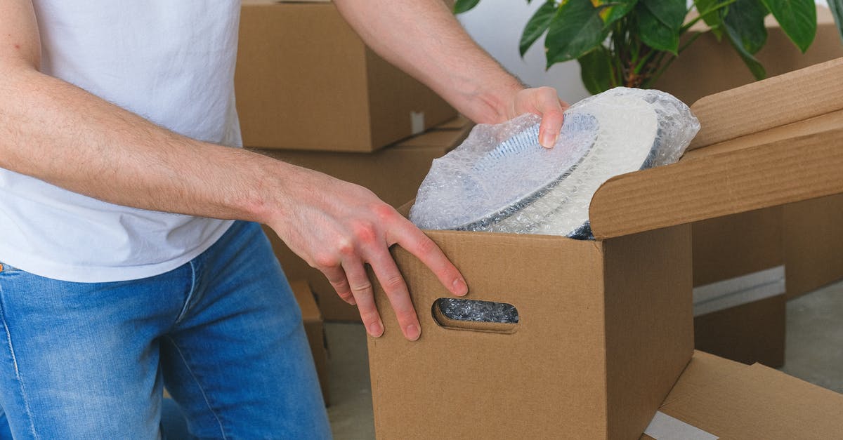 Can you find an item more than once with Move-Find Item? - Crop anonymous male in casual clothes packing fragile plates in carton box before moving into new flat in daylight Can you find an item more than once with Move-Find Item? - Crop anonymous male in casual clothes packing fragile plates in carton box before moving into new flat in daylight