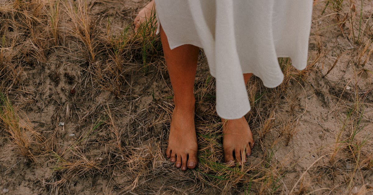 Can you free a grounded boat? - Photo Of Person Standing On Grass
