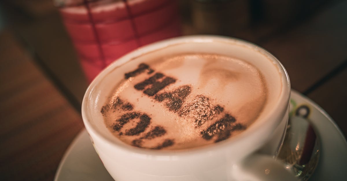 Can you increase your energy above maximum? - Cup of aromatic cappuccino with Thank You words on foam