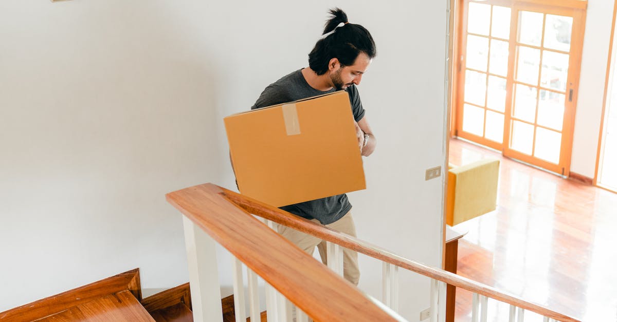 Can you make an empty sub area change from horizontal to vertical? - From above of full length male in casual clothes carrying carton box down stairs while moving personal items to new house Can you make an empty sub area change from horizontal to vertical? - From above of full length male in casual clothes carrying carton box down stairs while moving personal items to new house