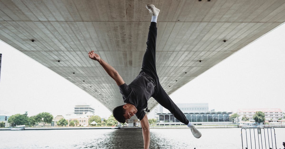 Can you move the position of the Hyperdrive after crafting it - Young man doing handstand on fence of river embankment