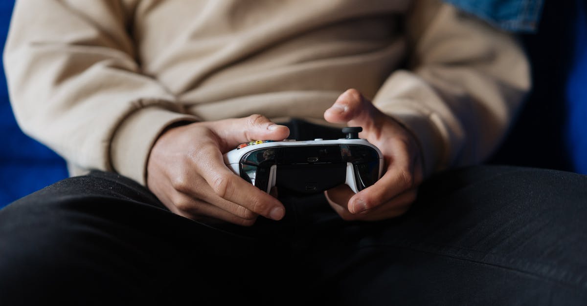 Can you play Black Ops 3 multiplayer cross platform on Xbox One and Xbox 360? [duplicate] - Person Wearing Sweater Holding Black and White Game Controller