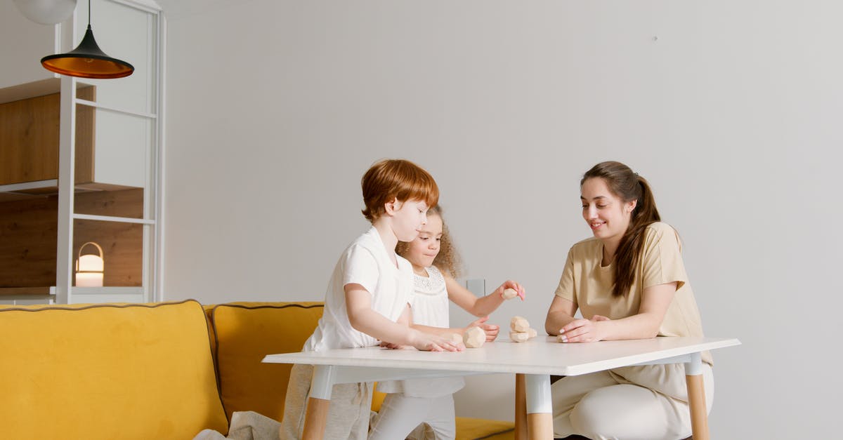 Can you play European N64 games on a Japanese console? - Woman in White Long Sleeve Shirt Sitting on Yellow Couch Can you play European N64 games on a Japanese console? - Woman in White Long Sleeve Shirt Sitting on Yellow Couch