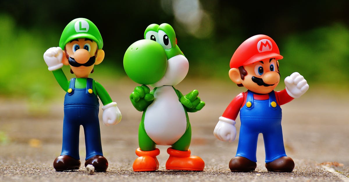 Can you put SNES roms on a Super Mario Bros Game & Watch? - Focus Photo of Super Mario, Luigi, and Yoshi Figurines