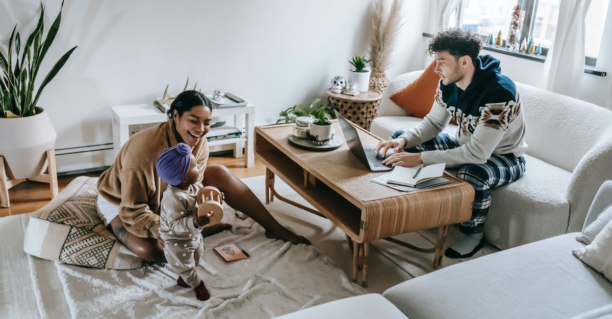 Can you remove a mom and dad from the living quarters once the mom is pregnant? - Diverse family with black baby in room with laptop Can you remove a mom and dad from the living quarters once the mom is pregnant? - Diverse family with black baby in room with laptop