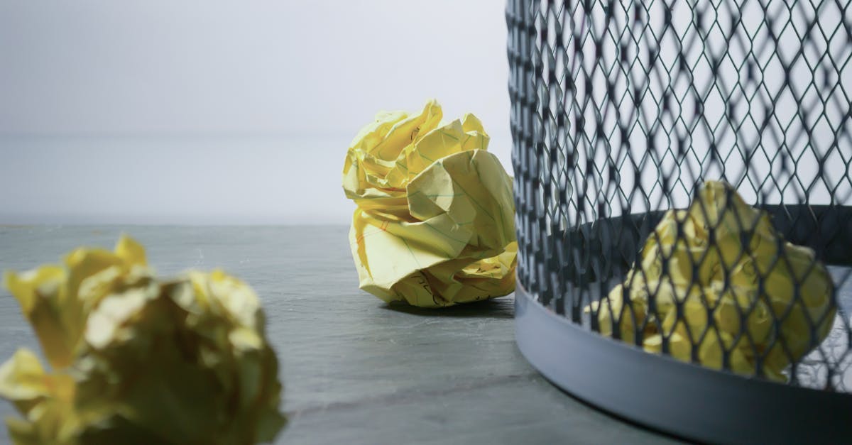 Can you retrieve a discarded item in No Mans Sky? - Focus Photo of Yellow Paper Near Trash Can