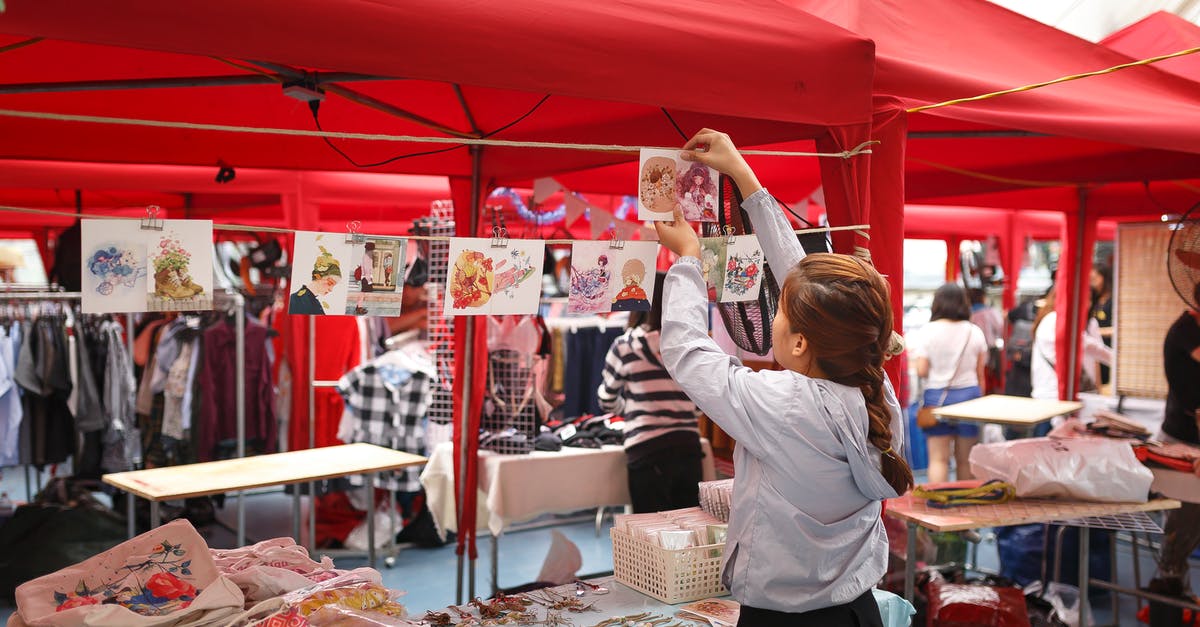 Can You Store Victory Crowns in Tents? - Girl Arranging Displays For Sale