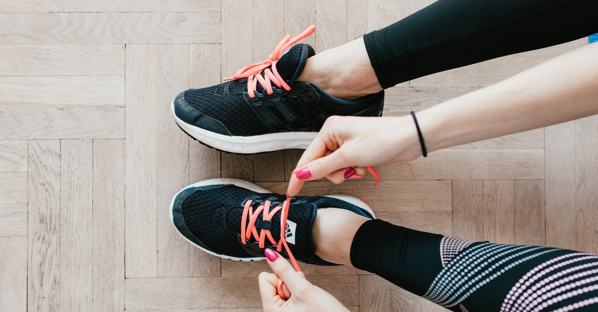 Can you transfer between a Google and a Trainer Club account? [duplicate] - Unrecognizable young sportswoman tying sneakers on floor