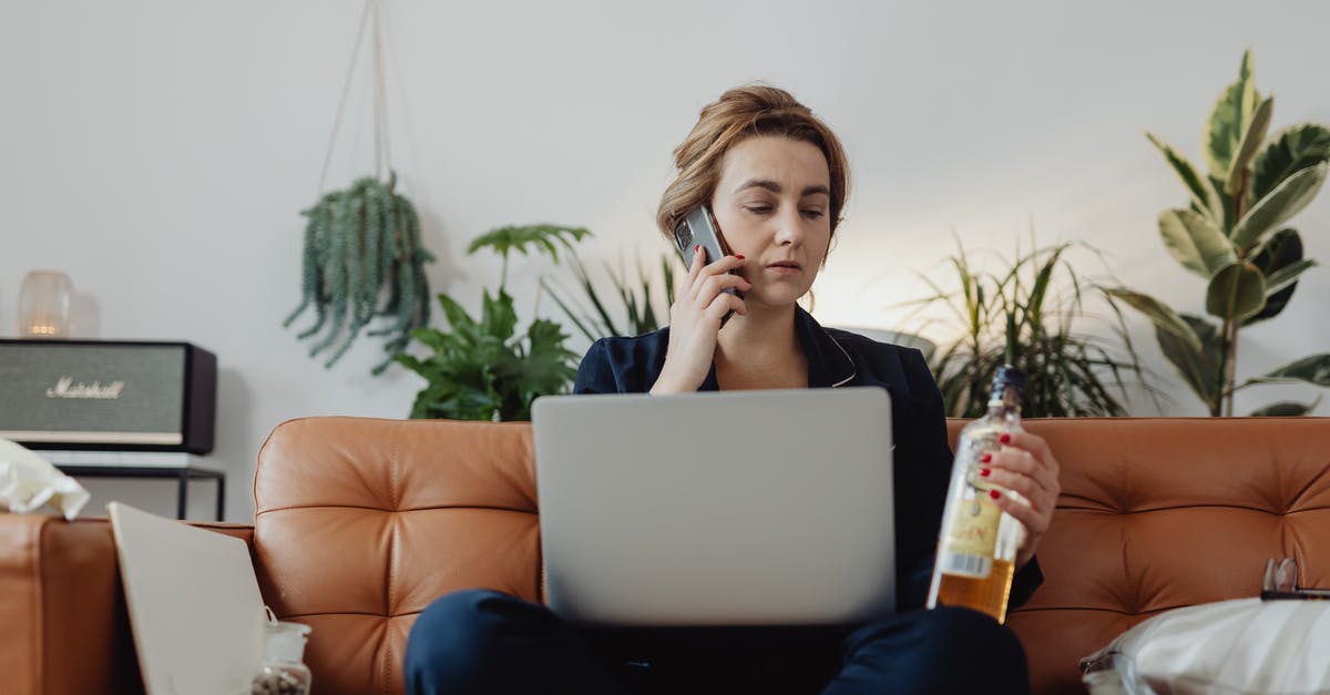 Cannot authenticate on phone [duplicate] - Woman Talking on the Phone and Holding a Bottle of Liquor 
