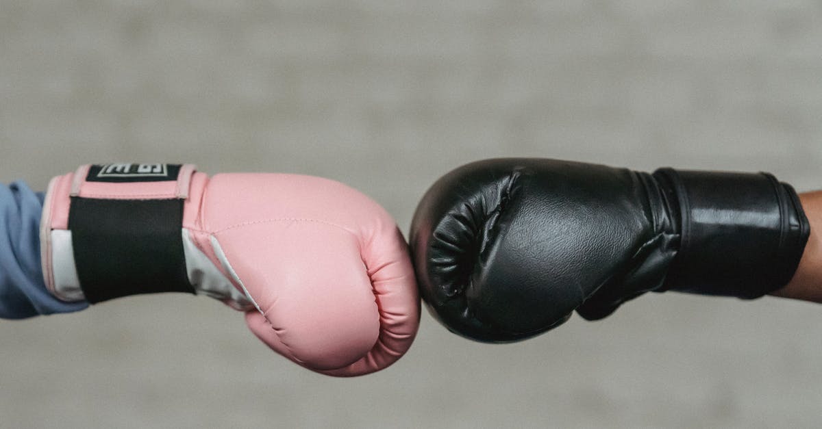 Cannot fight at Gym - Sid view of crop unrecognizable boxers in protective gloves bumping fists before fight in ring