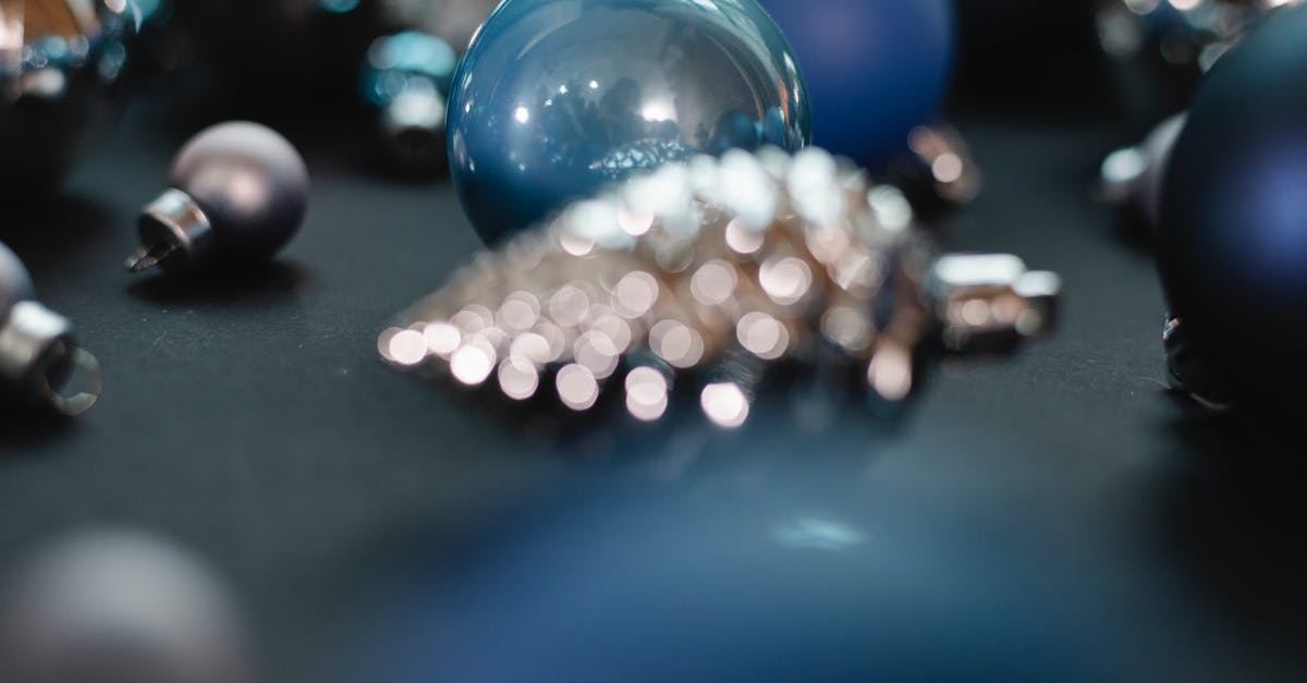 Cannot place calling card in Silver Shroud quest - Christmas decorative blue and silver balls with different shape near bump toy in bright place on black background Cannot place calling card in Silver Shroud quest - Christmas decorative blue and silver balls with different shape near bump toy in bright place on black background