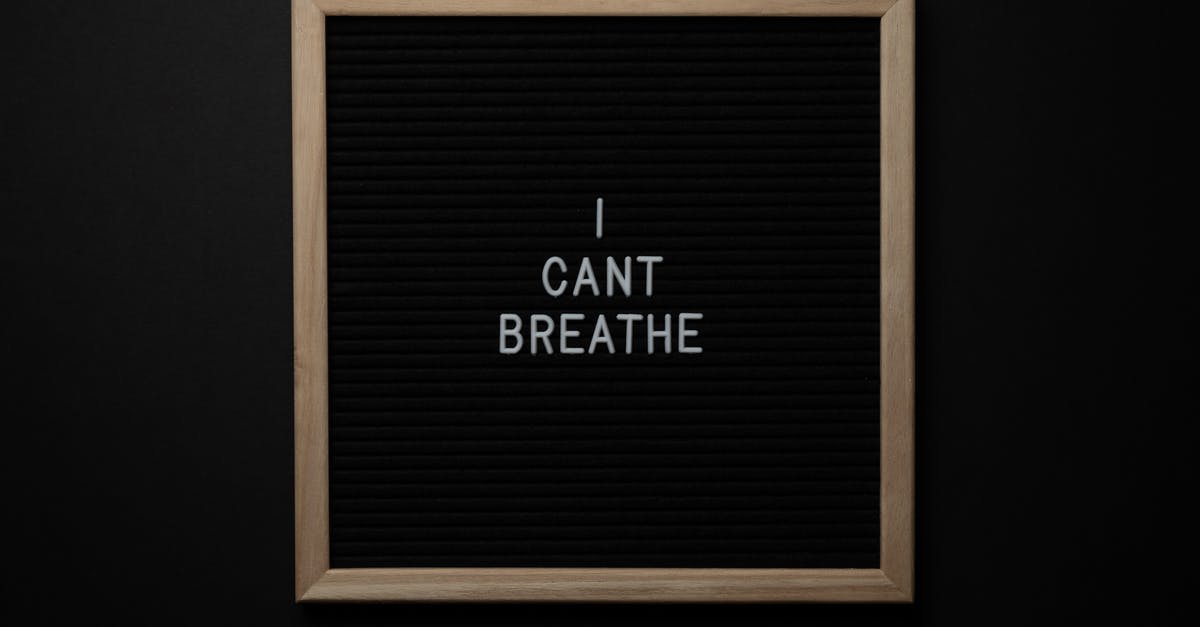 cant stop Steamclientbootsrapper from running and I cant delete steam! Help! - Top view of phrase I Cant Breath on small black signboard with light beige thin frame on black background