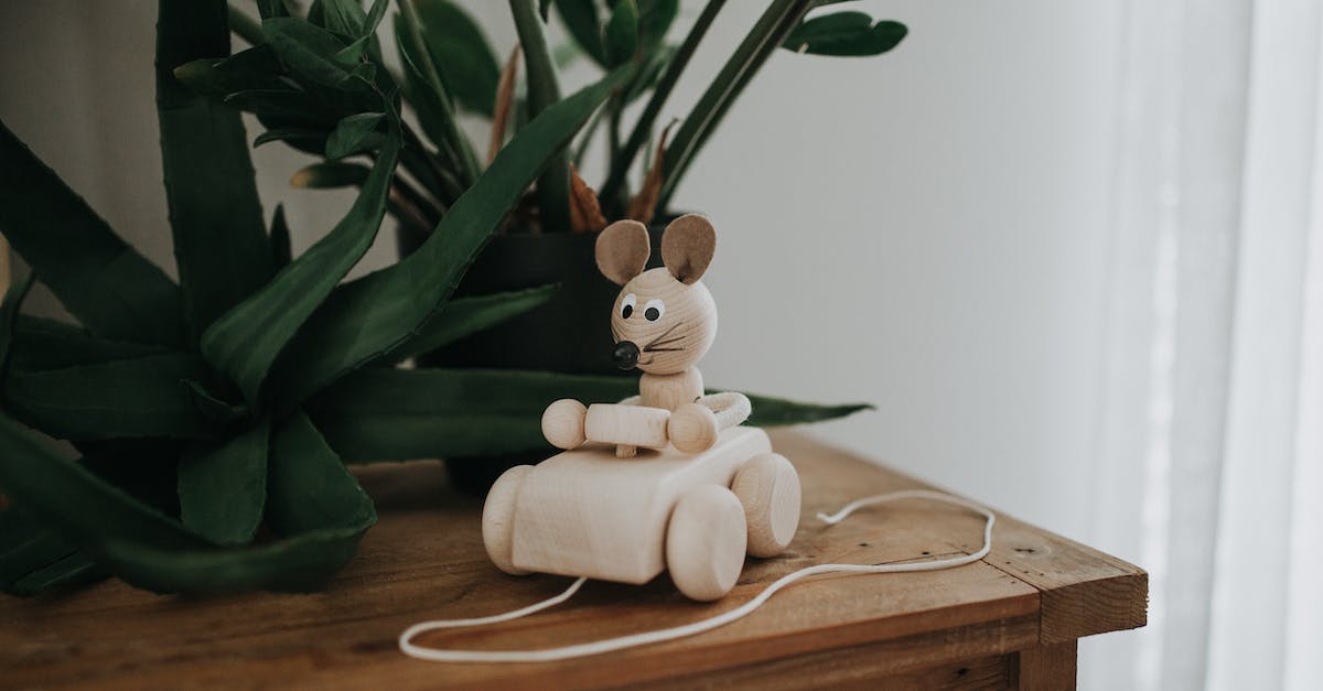 CAPS LOCK freezes mouse - A Wooden Mouse Toy Riding a Car on a Wooden Table