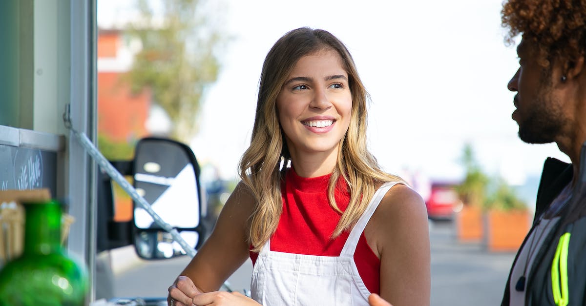 Casual veersus competetive dedicated servers in Counter Strike: GO - Positive female talking to black boyfriend near food truck