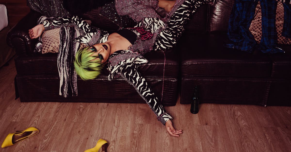 Chances of Hidden Ability through breeding, as well as chances for gender - Tired transsexual man with bright hairstyle and makeup in fashionable clothes resting on leather sofa after party