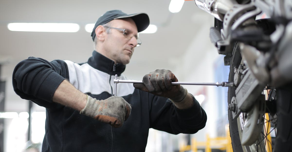 Changing colonies seems wasteful? - Photo of Man Fixing a Motorcycle