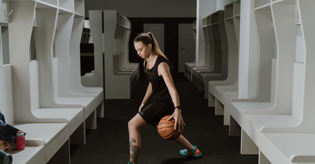 Changing Dimension of a player in Minecraft - Woman Dribbling a Ball Inside the Dressing Room Changing Dimension of a player in Minecraft - Woman Dribbling a Ball Inside the Dressing Room