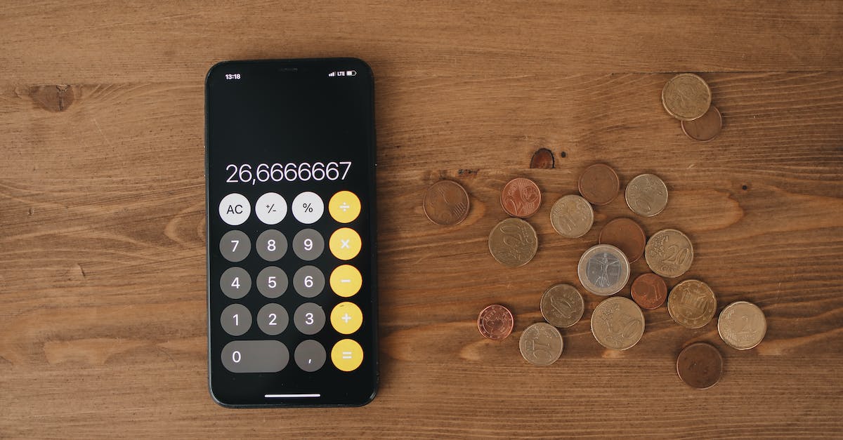 Changing screen in Skyrim? - Black Calculator And Loose Change On Wooden Surface