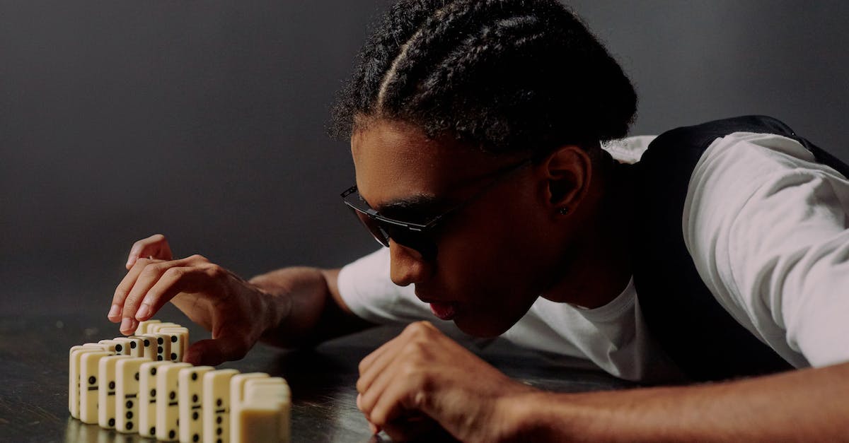 Changing Skin/Color in CS:GO [closed] - Man taking one of the domino blocks and focusing on it