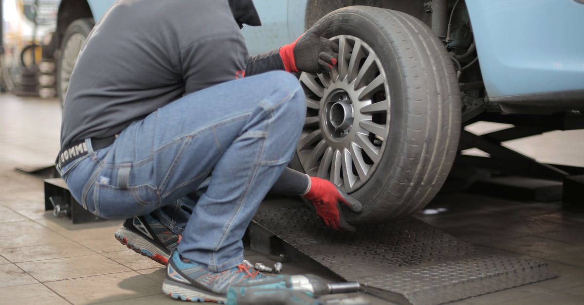 Changing the associated google-account for Ingress - Man Changing a Car Tire