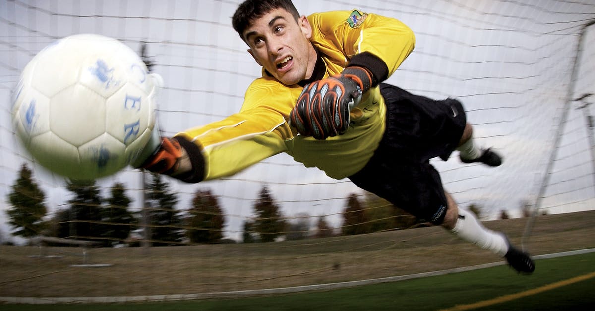 Changing the player limit for a team - Man Catching Soccer Ball on Field Changing the player limit for a team - Man Catching Soccer Ball on Field