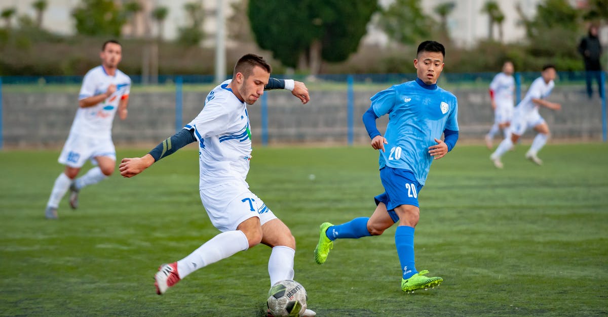 Changing the player limit for a team - Man Wearing Blue Shirt Looking on Ball Changing the player limit for a team - Man Wearing Blue Shirt Looking on Ball