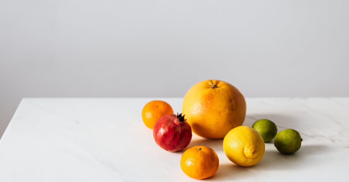 Character selection layout with DLC - Citrus fruits and pomegranate placed on white table